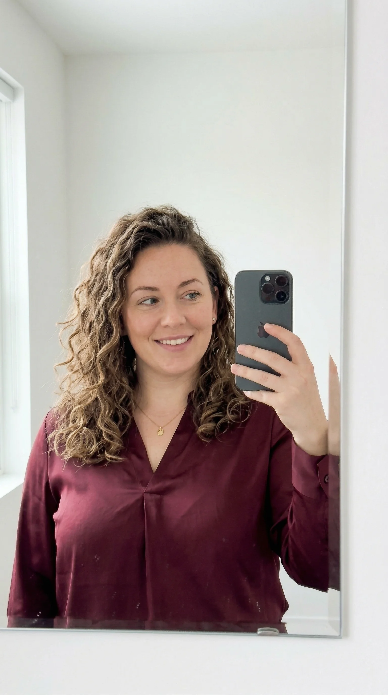 Progress photo in a burgundy sweater